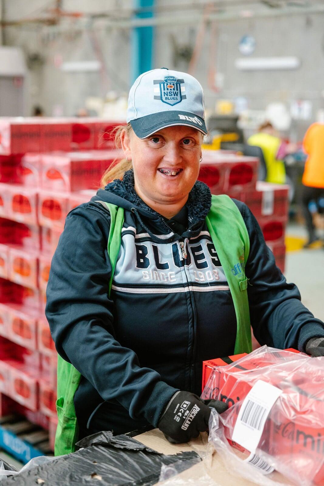 Supported employee packing products at Afford ADE